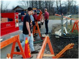 Mar 7, 2000. Repairing watermain break at High School.